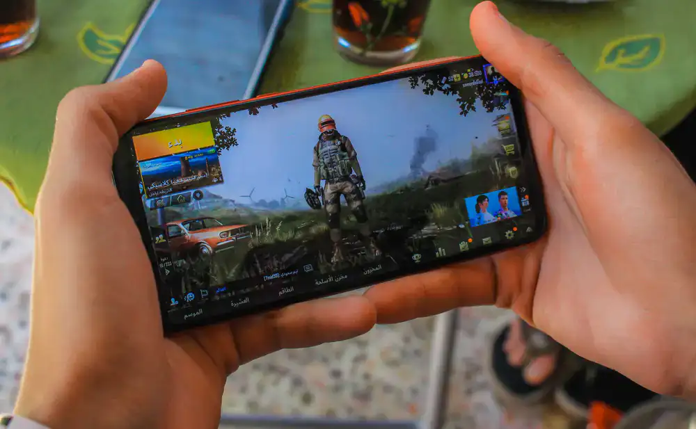 Colorful mobile game interface showing coin bursts and characters