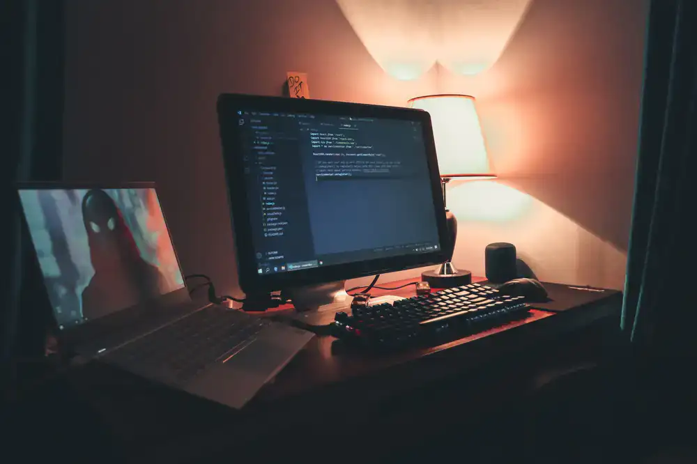 A bright workspace showing game development concepts on screen