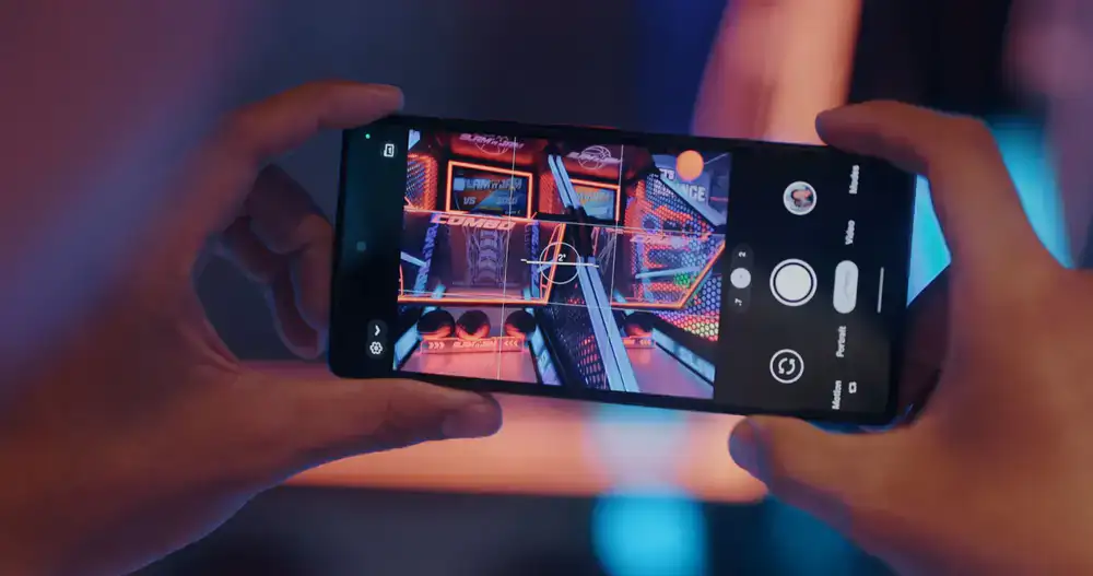 Mobile phone displaying a bright, colorful idle clicker game
